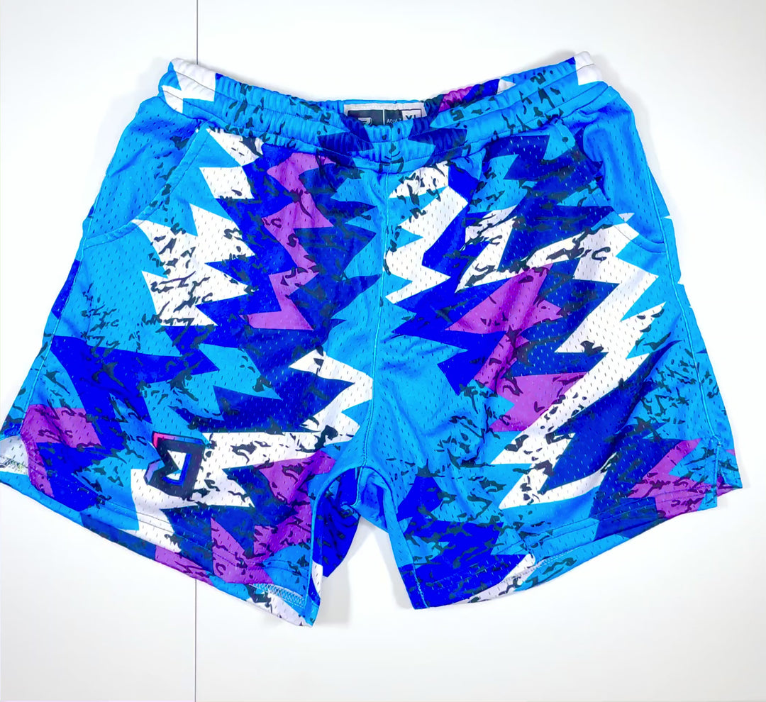 video of sky blue,  purple, navy blue, royal blue and white mesh athletic trap'n shorts