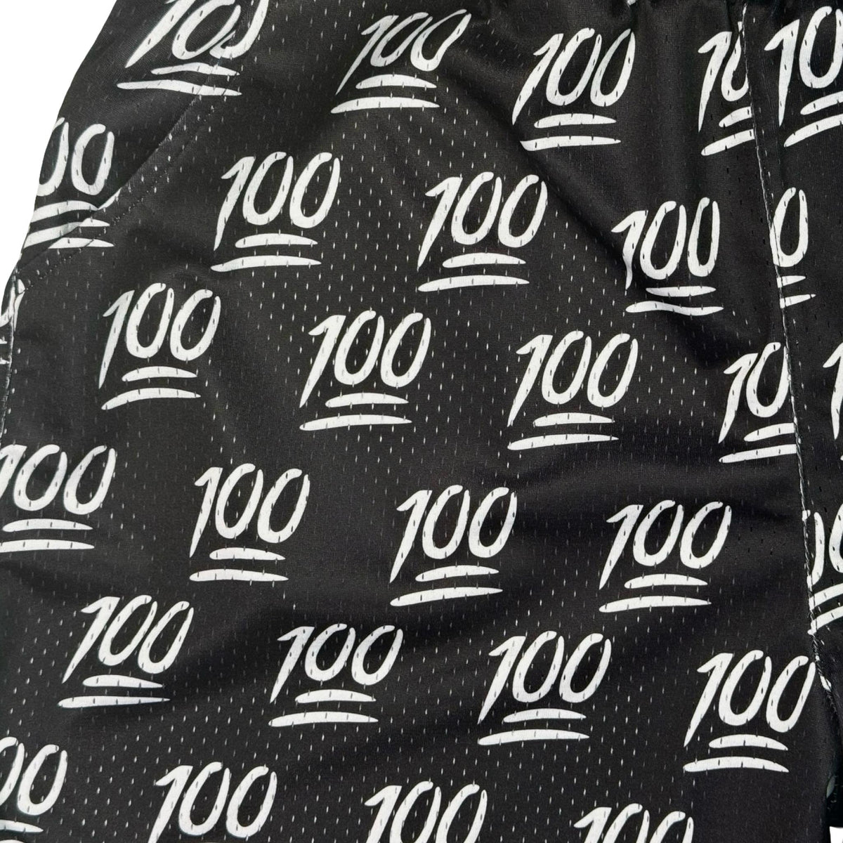 Black fabric with white '100' pattern