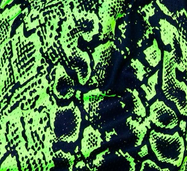 Neon green and black mesh snake print shorts texture