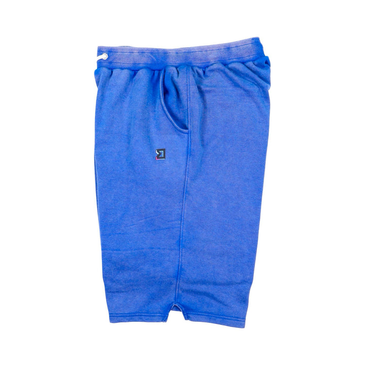Blue acid wash loopback shorts with a small logo on a white background