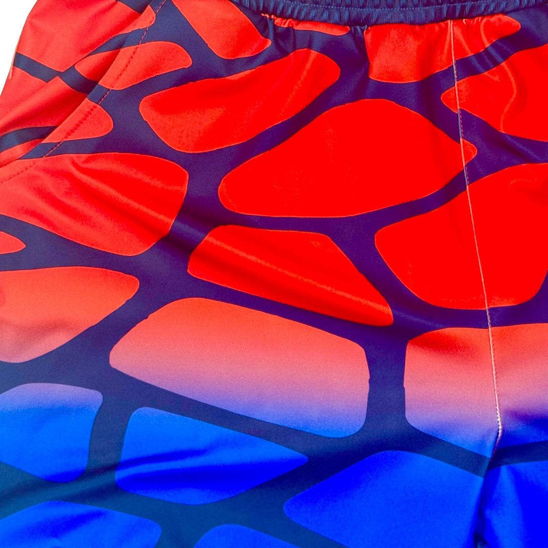 Red and blue cobblestone pattern smooth dry fit shorts closeup texture
