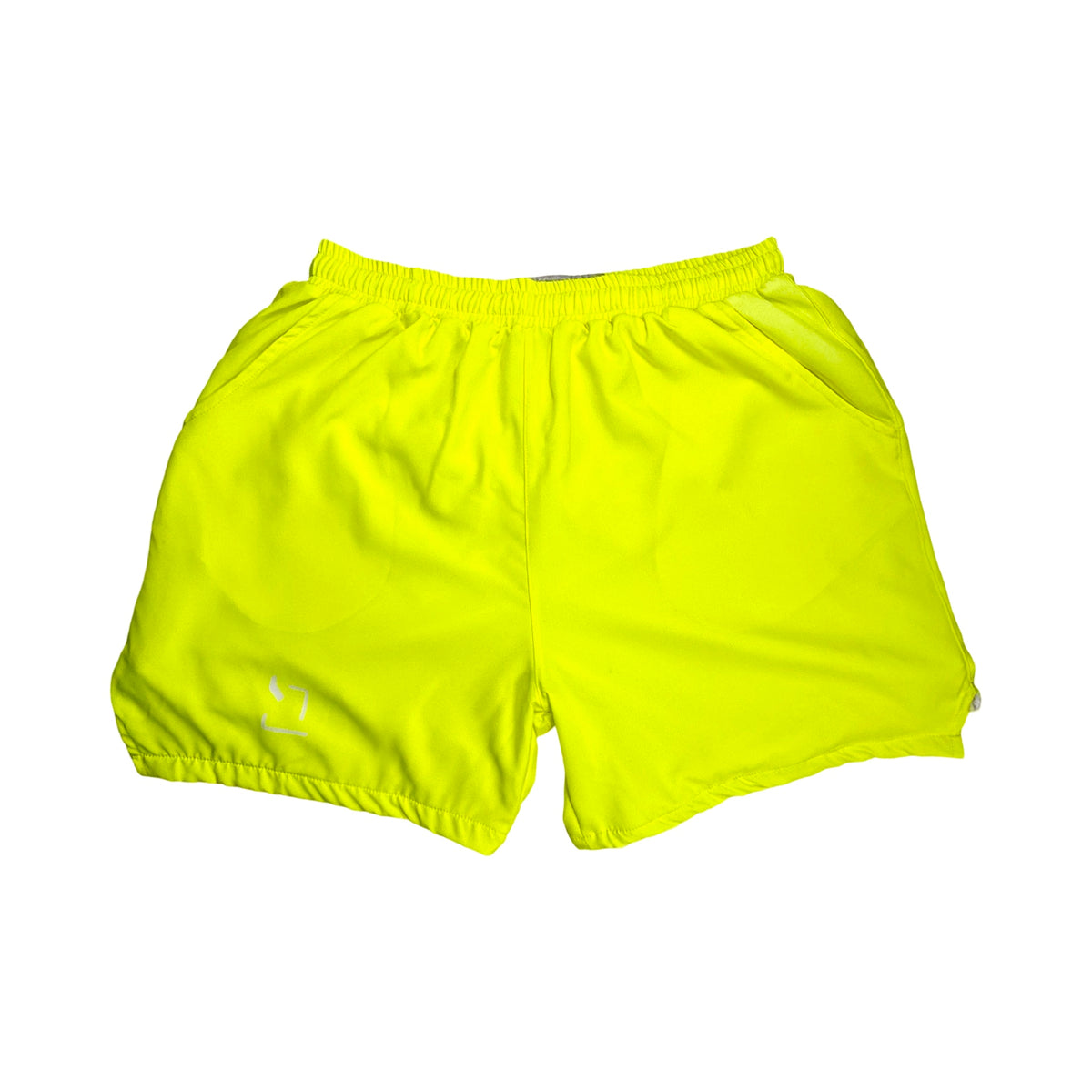Bright neon yellow shorts on a white background