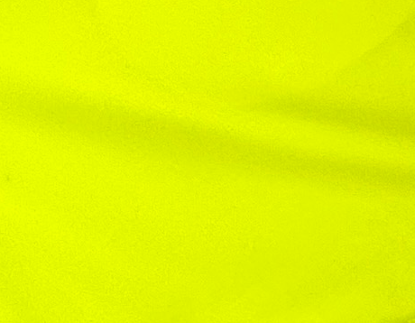Bright neon yellow shorts on a white background