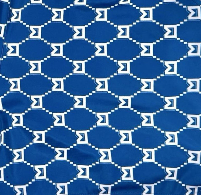 Closeup of fabric of Blue patterned shorts with white trim on a white background