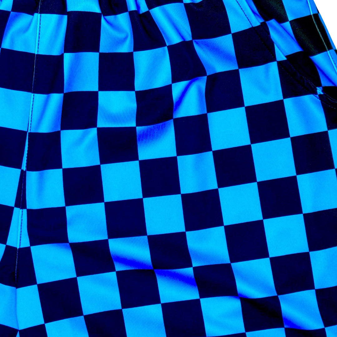 Blue and black dry fit shorts with checkerboard design closeup