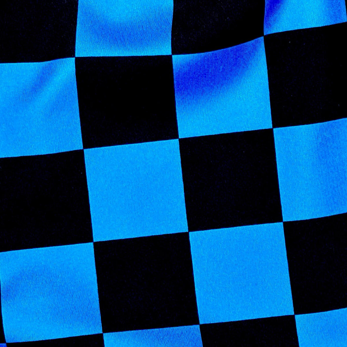 Blue and black dry fit shorts with checkerboard design fabric closeup