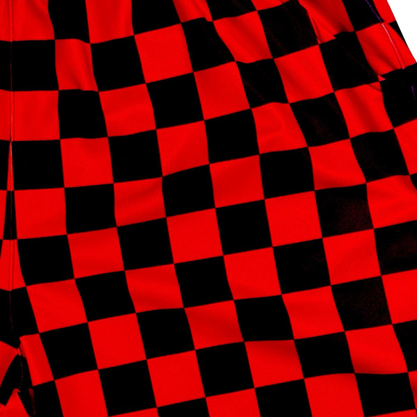 Red and black checkered shorts on a white background texture closeup