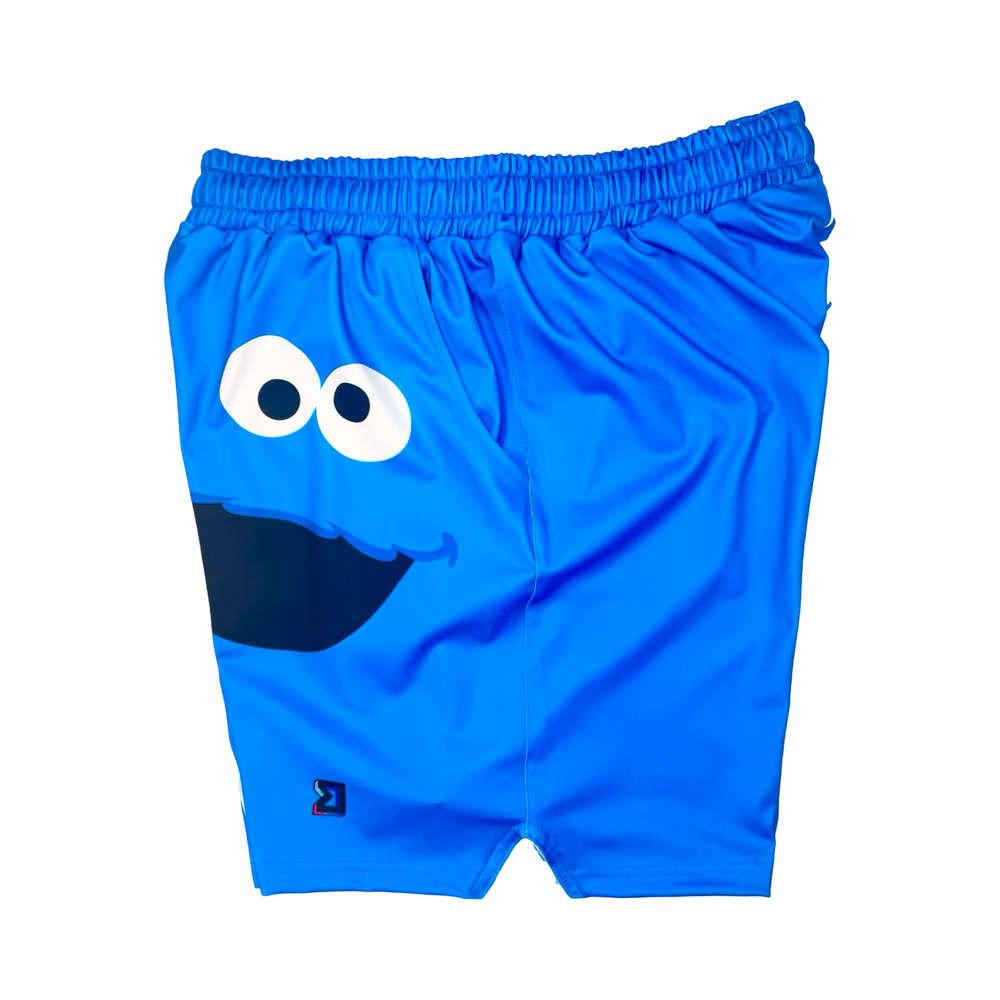 Blue shorts with a cartoon face design on a white background