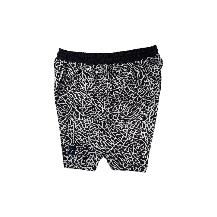 Side view of Black and white elephant print pattern soft dry fit shorts on a white background