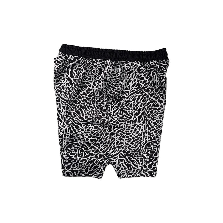 Other side view of Black and white elephant print pattern soft dry fit shorts on a white background