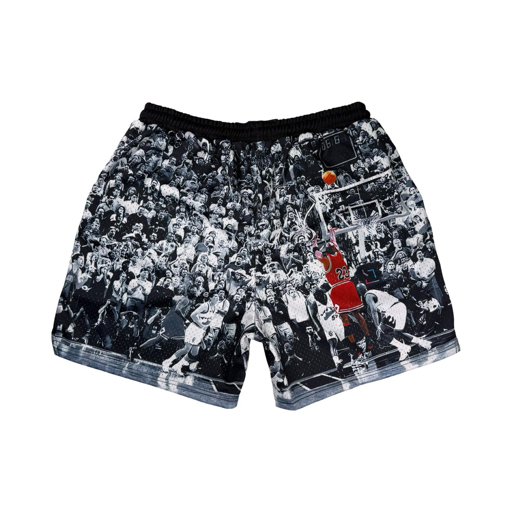 Shorts with a black and white vintage game winner photo design featuring a basketball player in action on a white background.