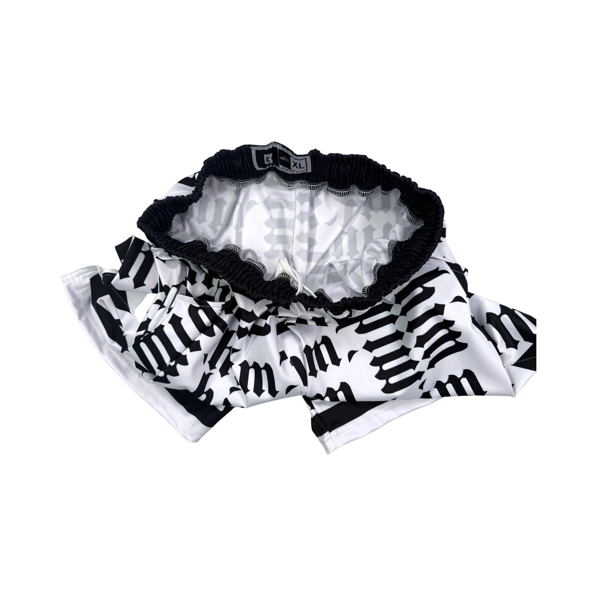 Black and white shorts with 'him' text pattern on a white background