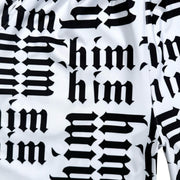 Closeup of Pattern of the word 'him' repeated in black and fabric on a white background