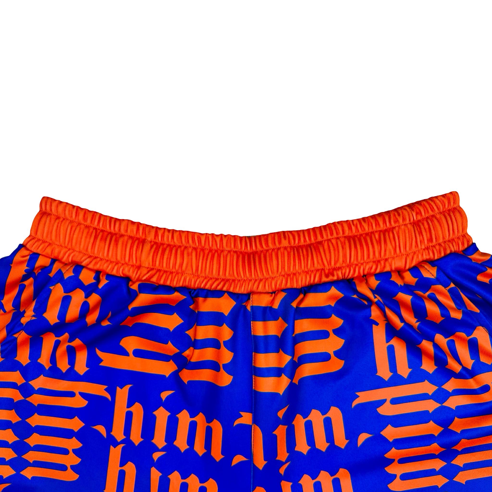 Purple soft dry fit shorts with repeating orange him text pattern on a white background