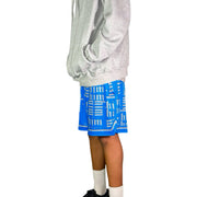 Person wearing a gray hoodie and blue shorts with silver text on a white background