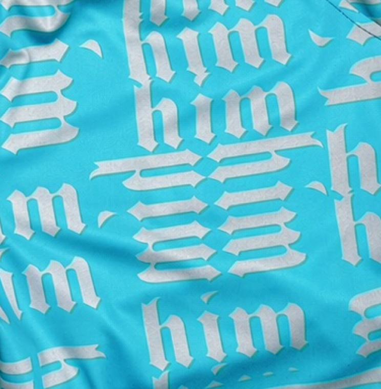 Closeup texture view of Blue shorts with silver him text pattern