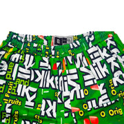 Green shorts with fruit candy box mosaic style pattern
