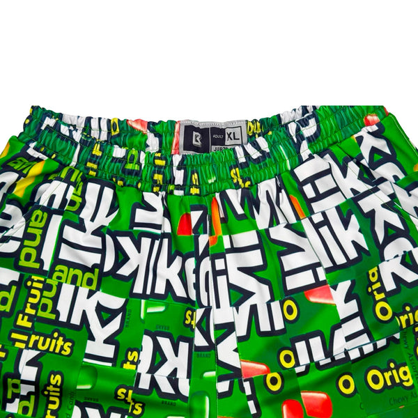Green shorts with fruit candy box mosaic style pattern