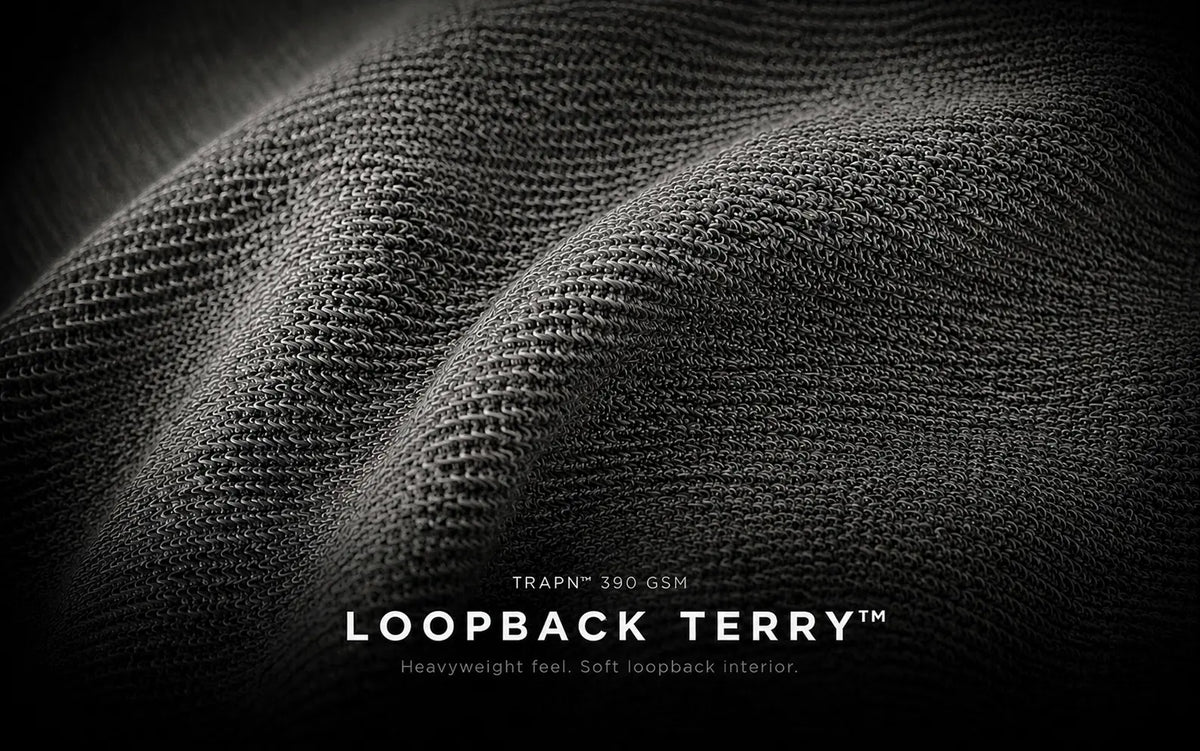 Close-up of the unbrushed looped interior construction of TRAPN™ OFF COURT™ Loopback Terry™ hoodie fabric.