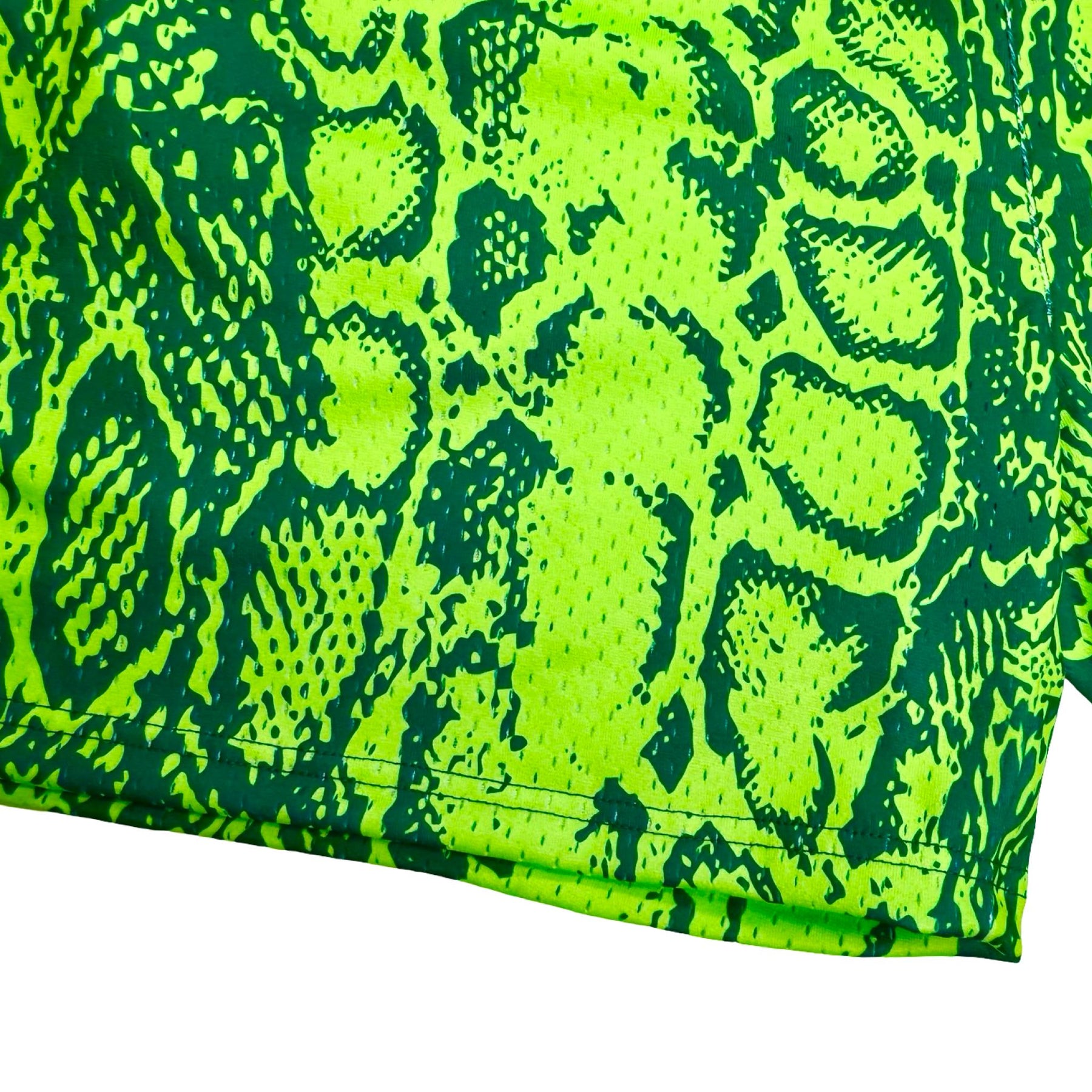 Neon green mesh basketball shorts with snake print