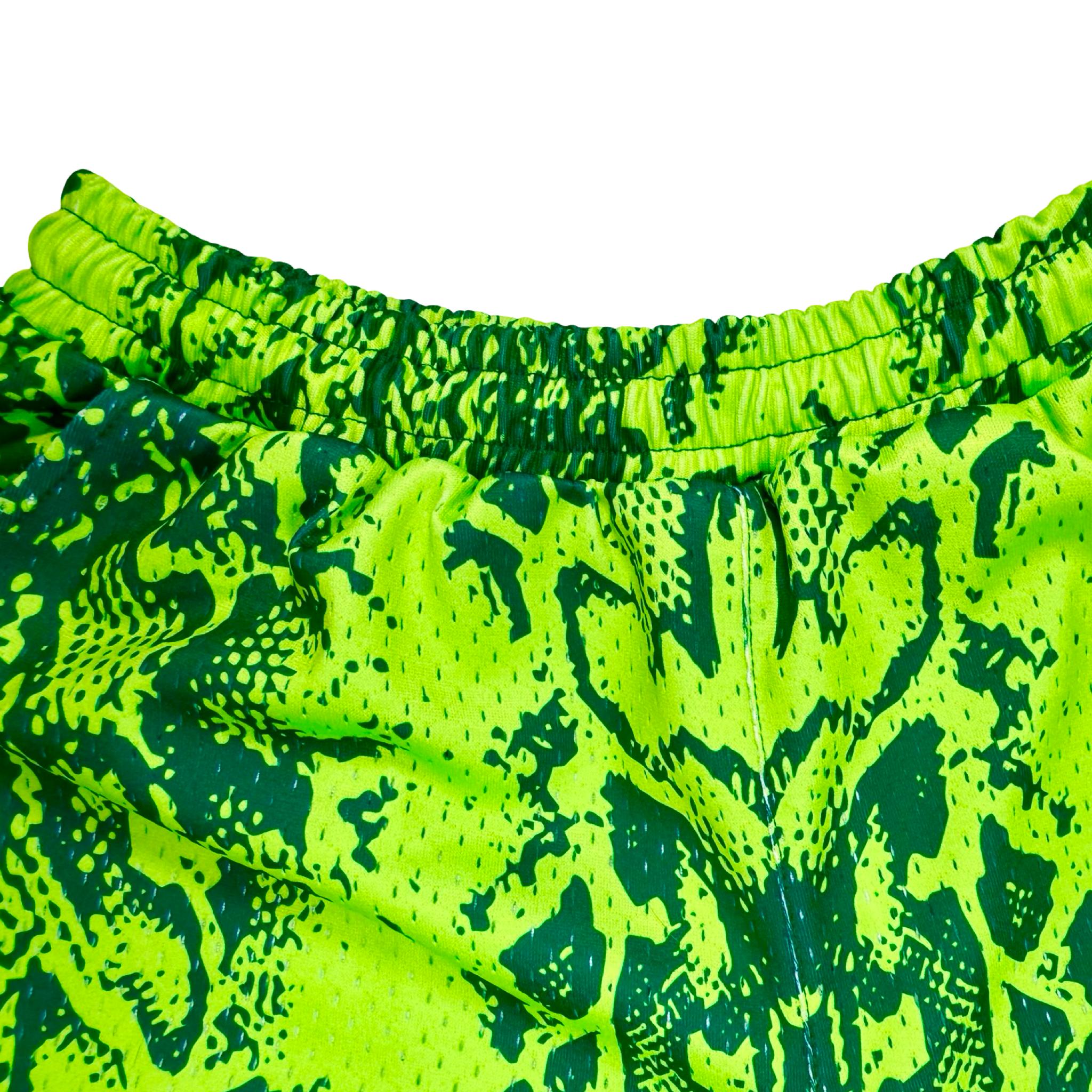 Neon green mesh basketball shorts with snake print