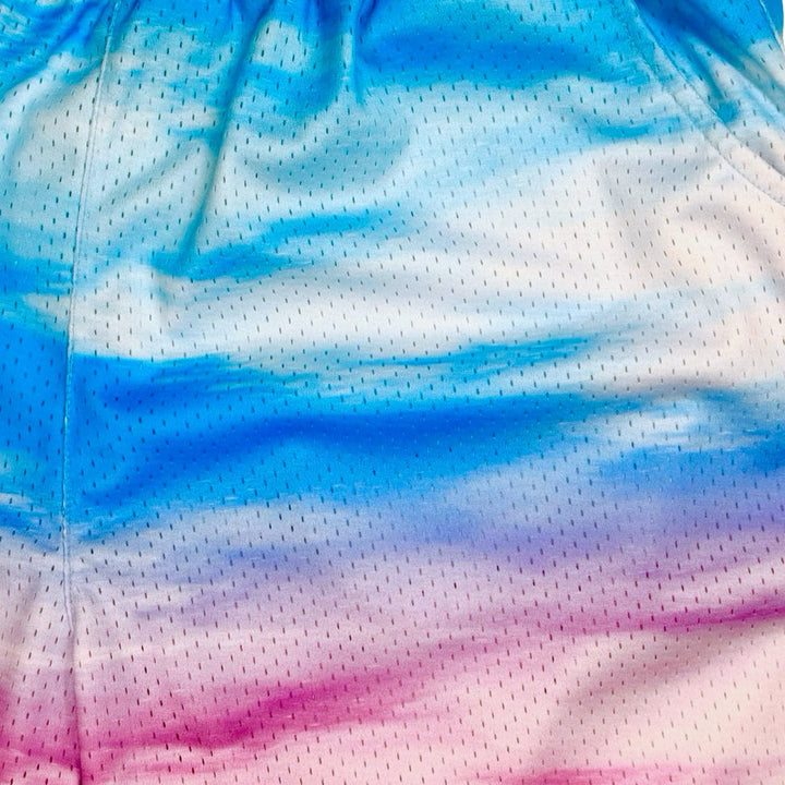 pink and sky blue cloud gradient mesh shorts texture closeup