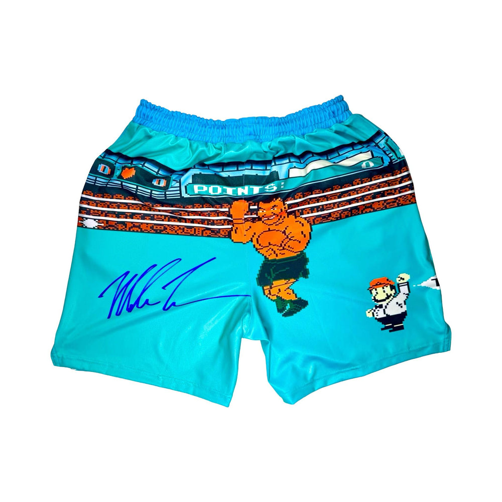 Back side of Turquoise dry fit shorts with pixel punch boxing game characters on a white background
