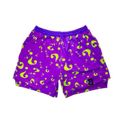 Purple shorts with green question mark pattern on a white background