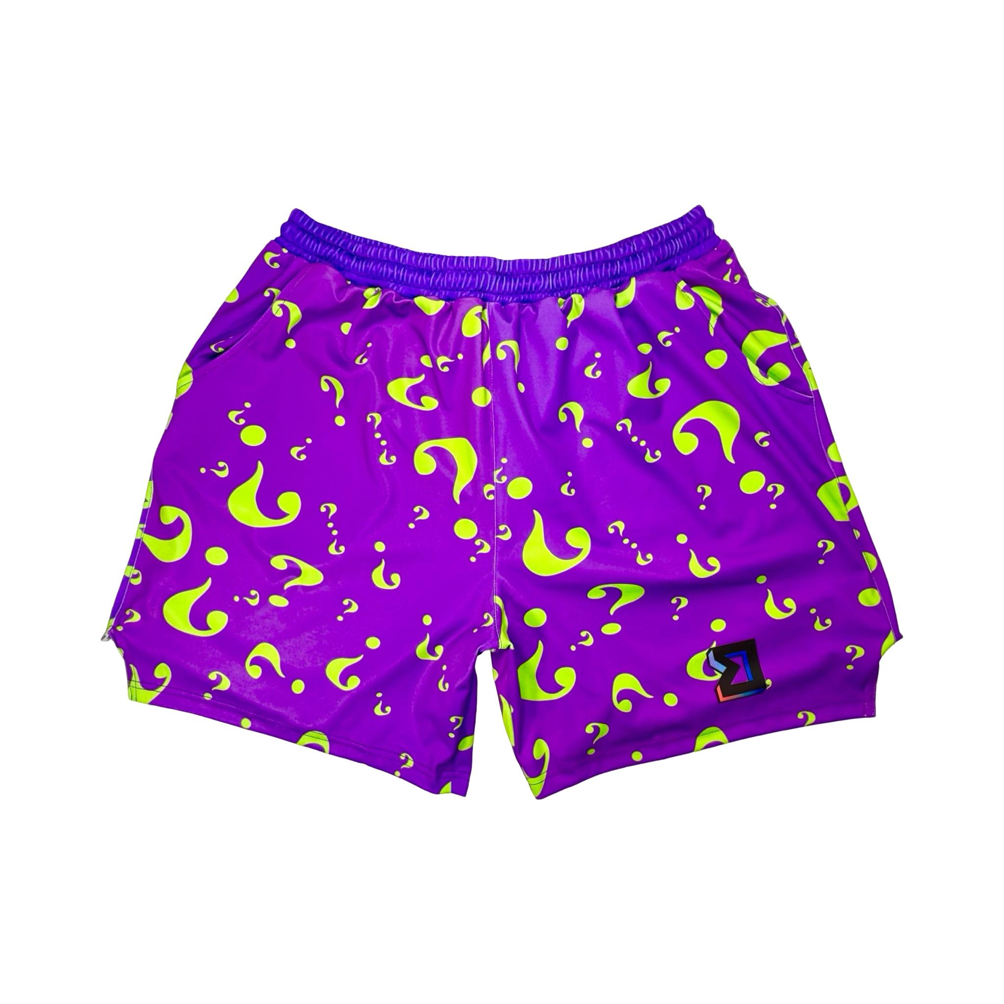 Purple shorts with green question mark pattern on a white background
