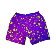 Purple shorts with green question mark pattern on a white background