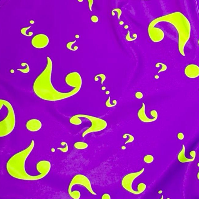 Purple fabric with green question marks and droplets