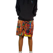 Person wearing a black hoodie and colorful shorts with graphic designs on a white background