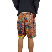 Shorts with a colorful graphic design of various faces on a white background