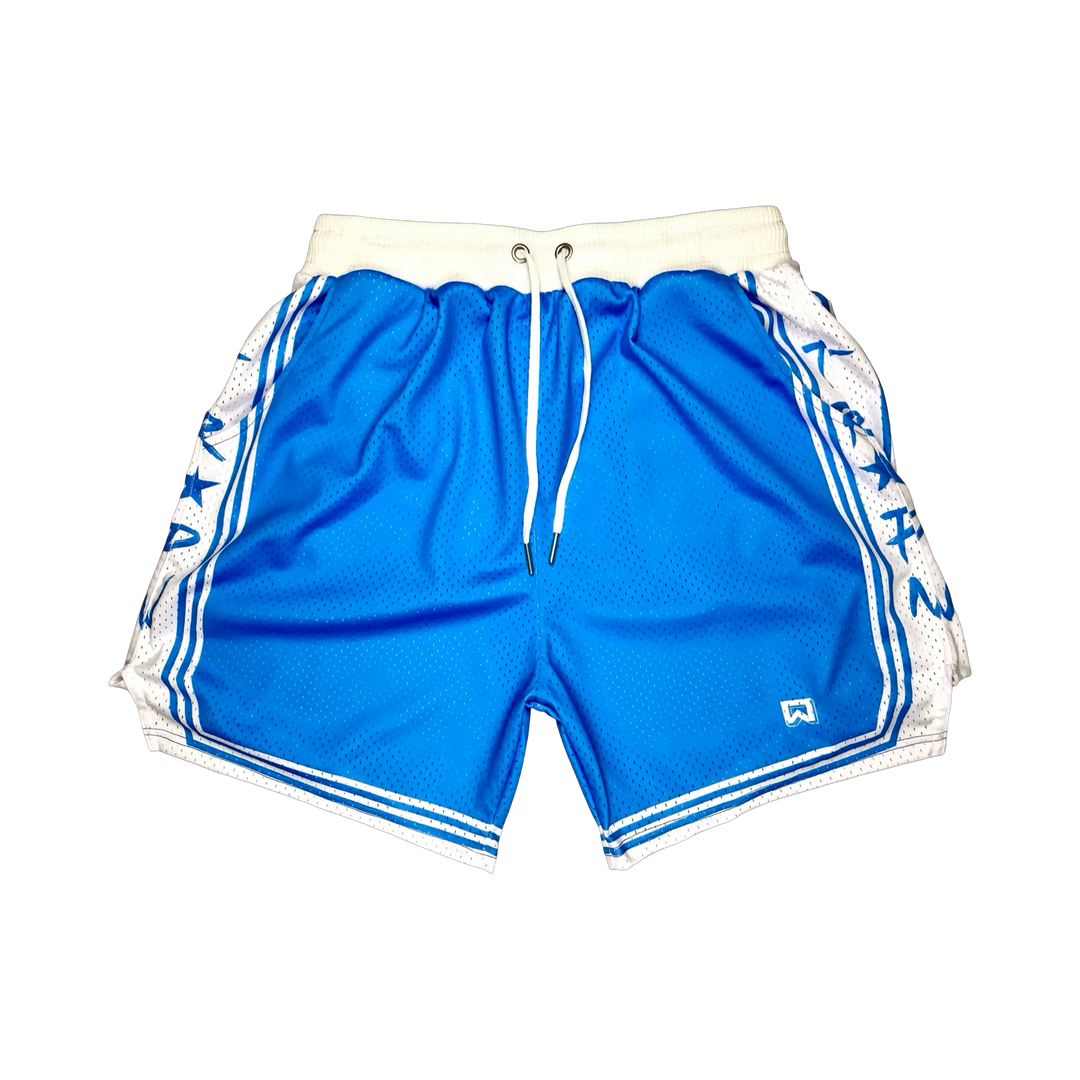 Showtime Elite PRO™ Sky basketball shorts featuring a vibrant sky blue MeshX™ body, white oversized PRO waistband, premium athletic fit, and classic basketball styling designed to match University Blue and Nike basketball sneakers.