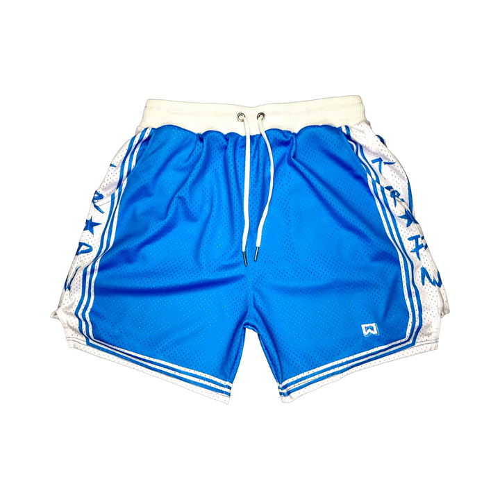 Showtime Elite PRO™ Sky basketball shorts featuring a vibrant sky blue MeshX™ body, white oversized PRO waistband, premium athletic fit, and classic basketball styling designed to match University Blue and Nike basketball sneakers.