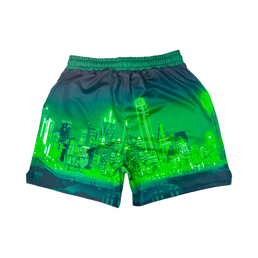 Back side view of Skyline green dry fit shorts with skyline graphic on white background.