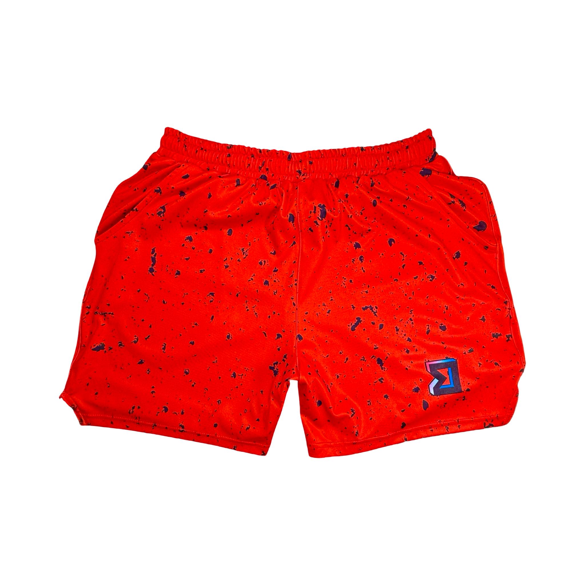 Red soft dry fit basketball shorts with black speckle repeating pattern on a white background