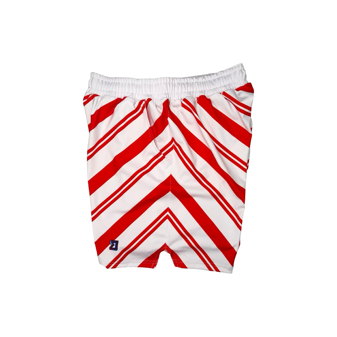 Side view of White dry fit shorts with red Candy cane striped pattern on white background.