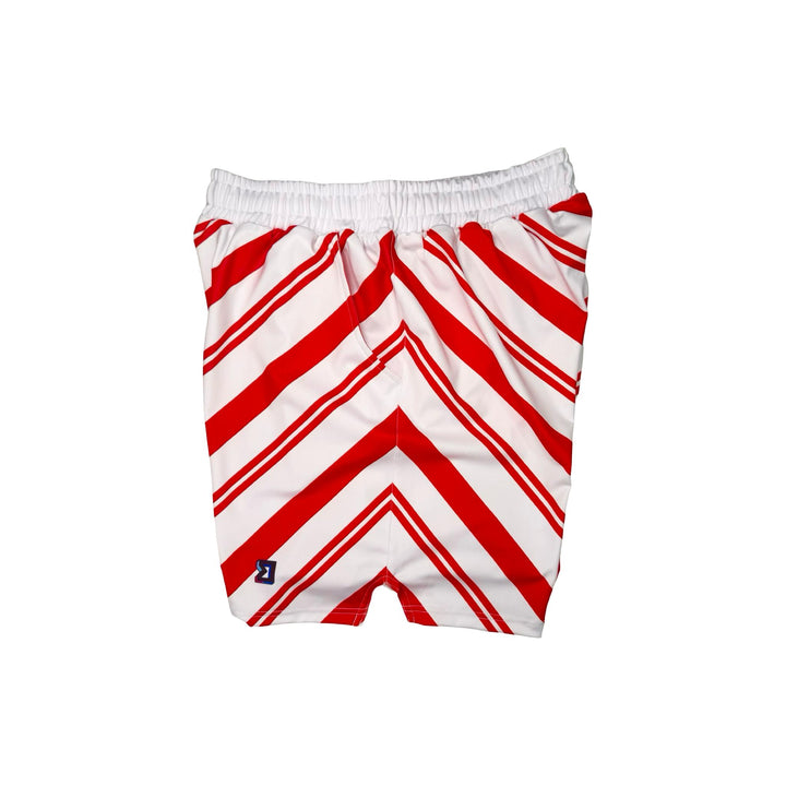 Side view of White dry fit shorts with red Candy cane striped pattern on white background.