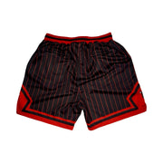 Black basketball shorts with thin red pinstripes, red side panels, and a red waistband, shown flat on a white background.