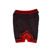 Black and red pinstriped athletic shorts with a red waistband and a red geometric patch on the front, shown flat on a white background.