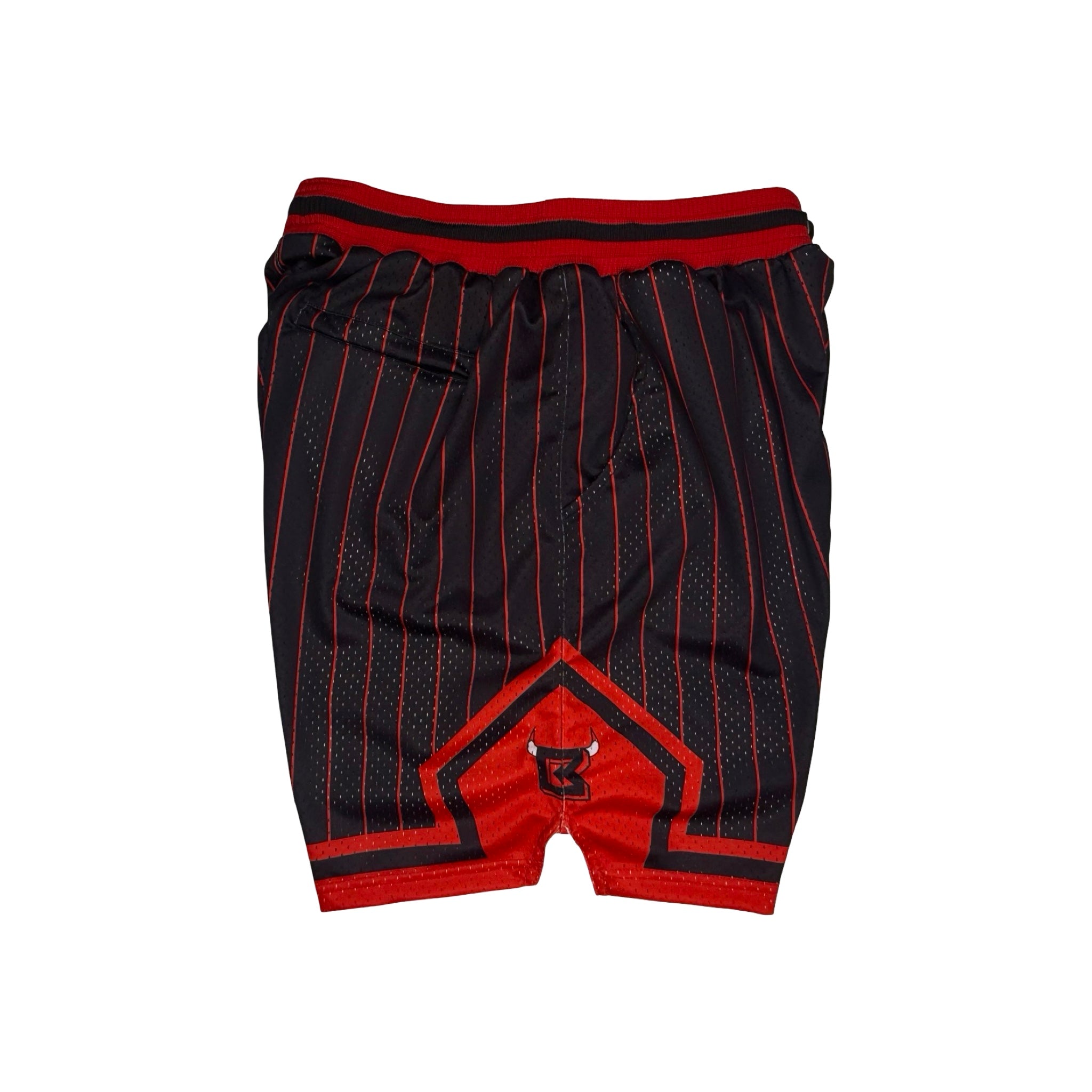 Black and red basketball shorts with thin red pinstripes, a red waistband, and a red geometric logo patch on the front.