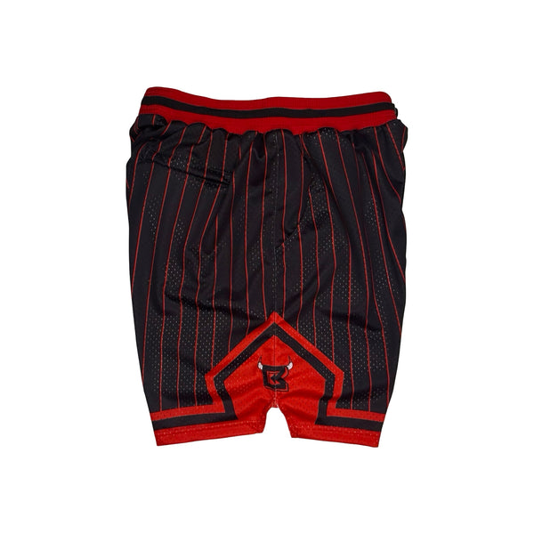 Black and red basketball shorts with thin red pinstripes, a red waistband, and a red geometric logo patch on the front.