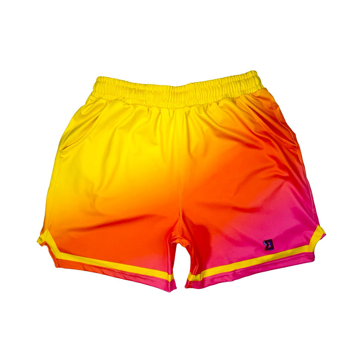 Sunburst yellow to pink gradient dry fit shorts with yellow stripe on white background.