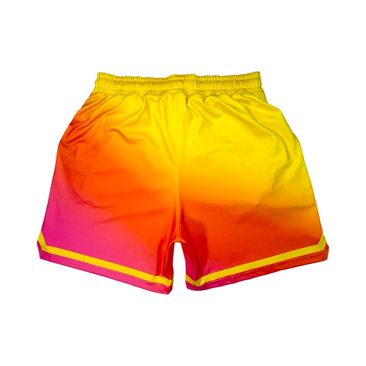 Back side view of Sunburst yellow to pink gradient dry fit shorts with yellow stripe on white background.