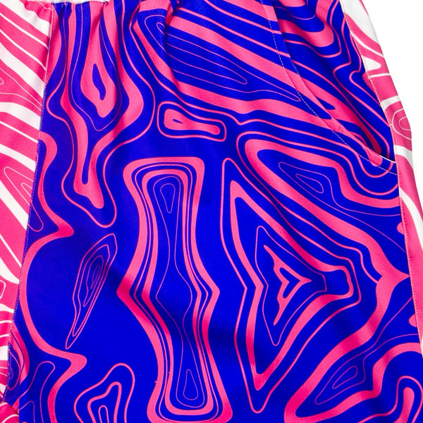 Pair of quick drying lightweight athletic shorts with pink and purple abstract swirling pattern with white waistband