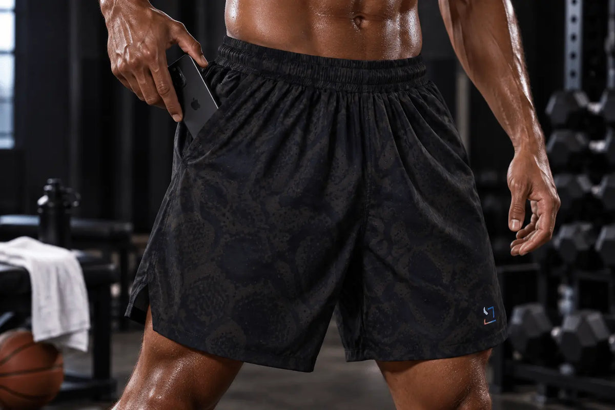 Deep front pocket on TRAPN™ TRAINING™ shorts holding a phone during training.