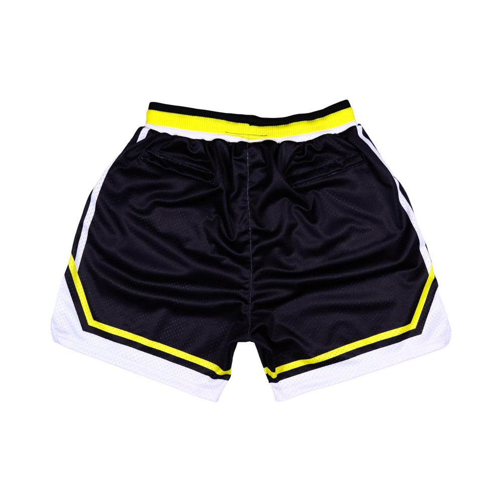Black pro style shorts with yellow and white stripes and logos
