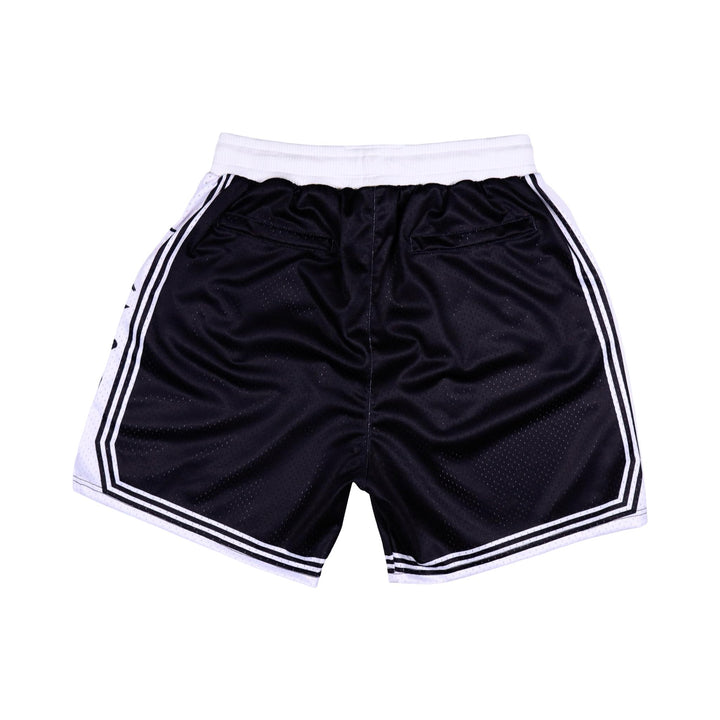 Back side of Black shorts with white accents on a white background