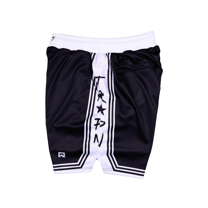 Side view of Black shorts with white accents on a white background